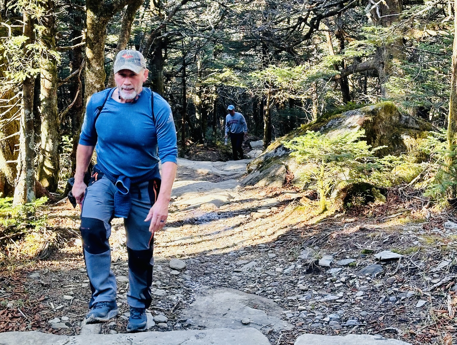 Andy Rein Hiking in a blue shirt